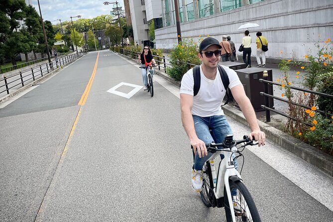 Osaka E-Bike Tour with a Local Guide - Stop 3: Osaka Castle park riding—and cherry-blossom season energy