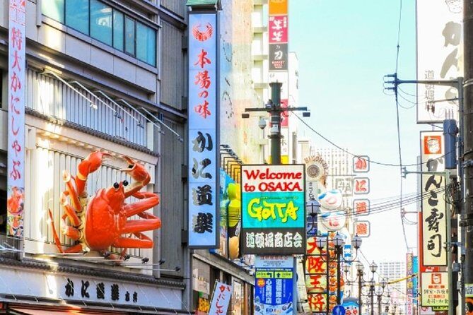 Osaka Private Tour by Public Transportation - Stop 1: Dotonbori District canals, bridges, and quick photo missions